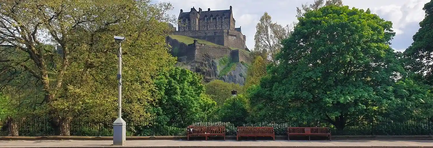 Students collaborating in a modern classroom with laptops