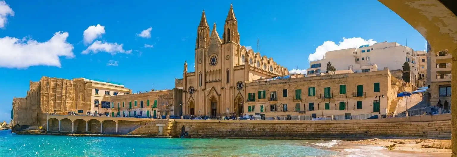 Students collaborating in a modern classroom with laptops