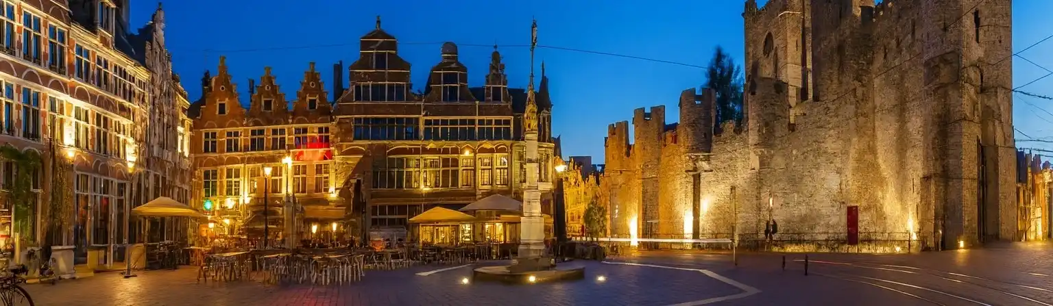 Students collaborating in a modern classroom with laptops