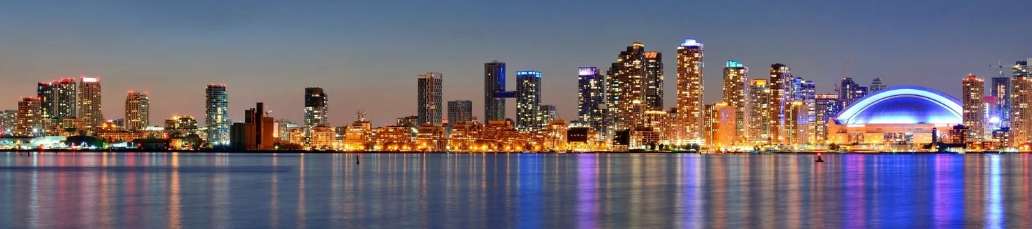 Students collaborating in a modern classroom with laptops